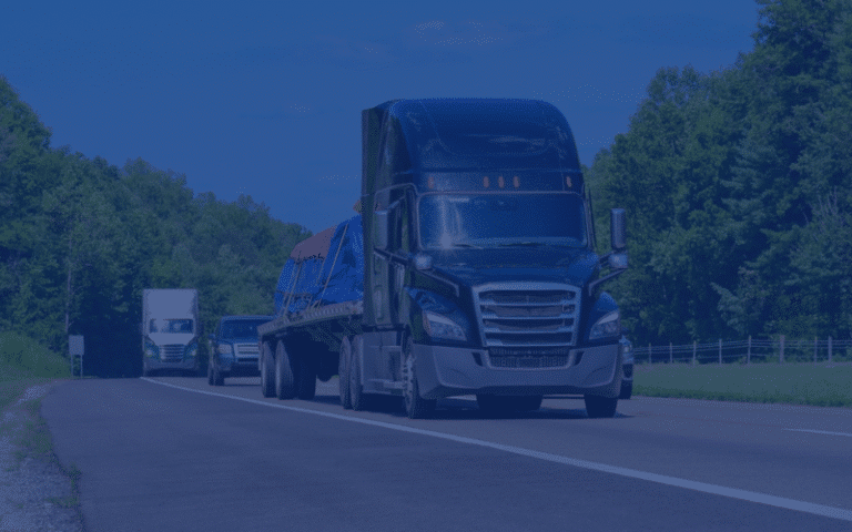 Flatbed Freight Services DARK FLIP flatbed truck on the road