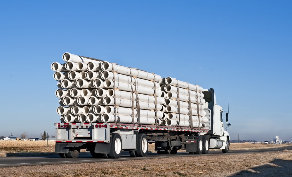 Flatbed Freight Services flatbed hauling plastic pipes