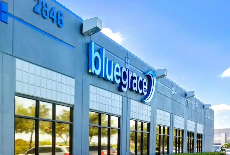 BlueGrace company sign on a modern grey office building with address number 2846.