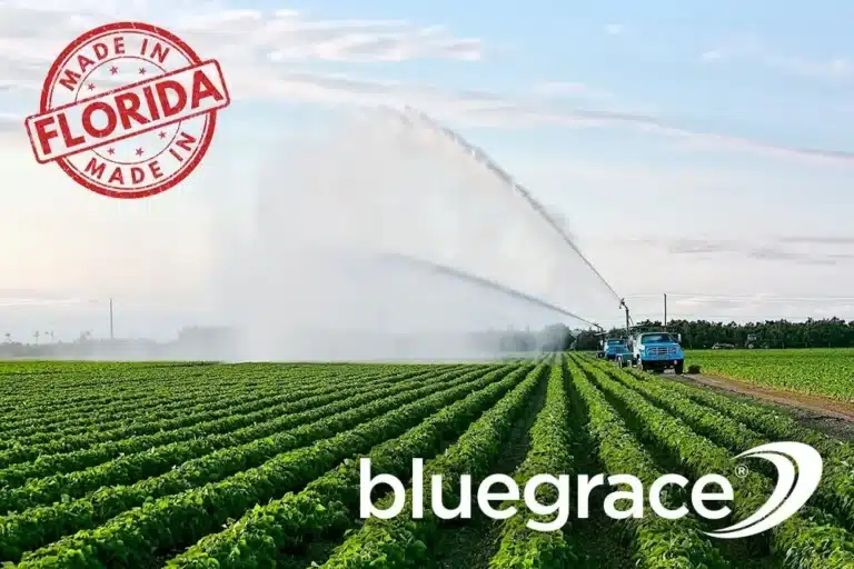 Large agricultural irrigation system watering a field with a "Made In Florida" stamp and BlueGrace logo.