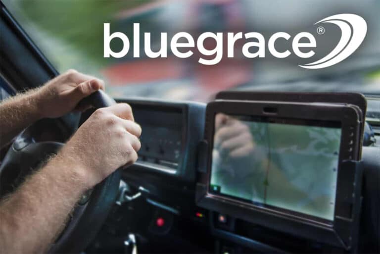 truck driver holding steering wheel with bluegrace logo
