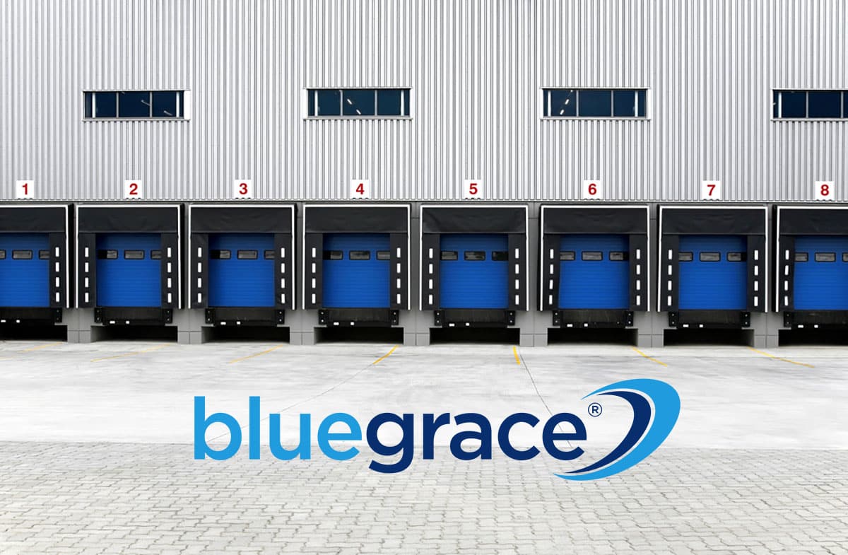 BlueGrace logo in front of a warehouse exterior with eight numbered blue loading dock doors.