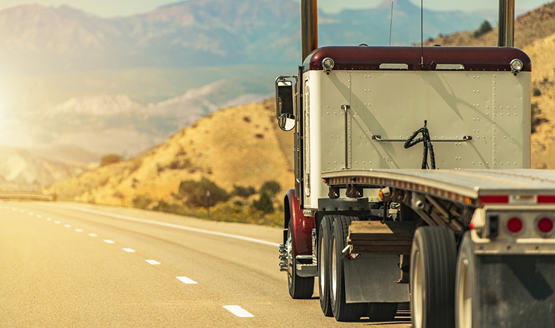 Semi Truck with Flatbed Trailer on a Scenic Utah Interstate 70 Highway
