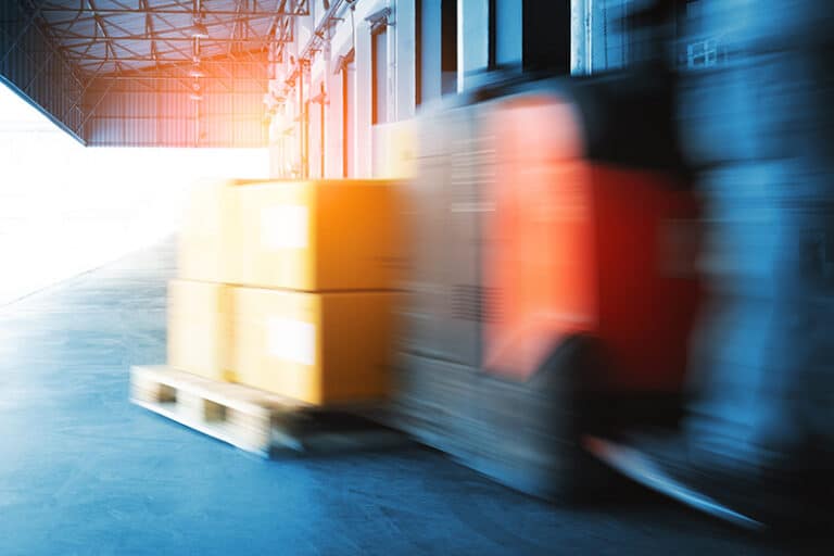 Fast Motion of Forklift Loading A Package Boxes in Warehouse