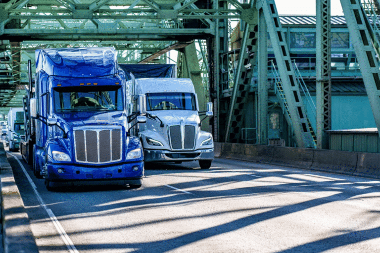 blue and white big rig semi-truck tractors transporting cargo