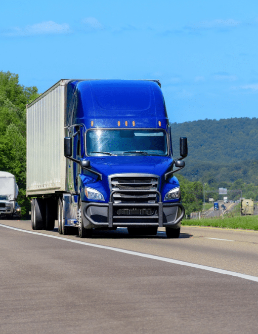 vertical shot of a blue eighteen wheeler
